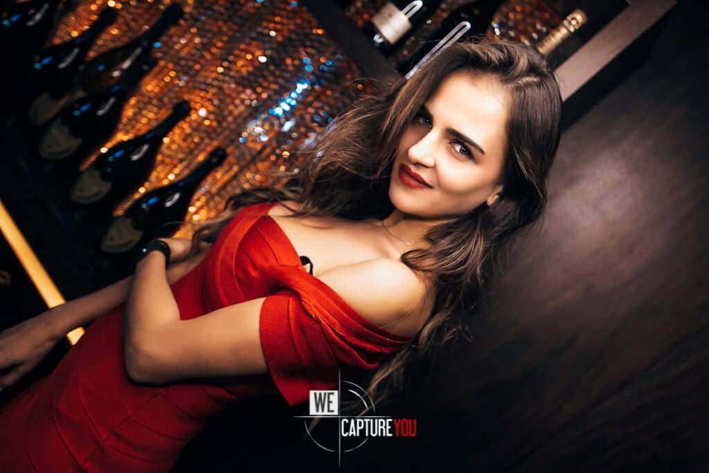 Stylish woman in red dress at WeCaptureYou professional photo shoot.