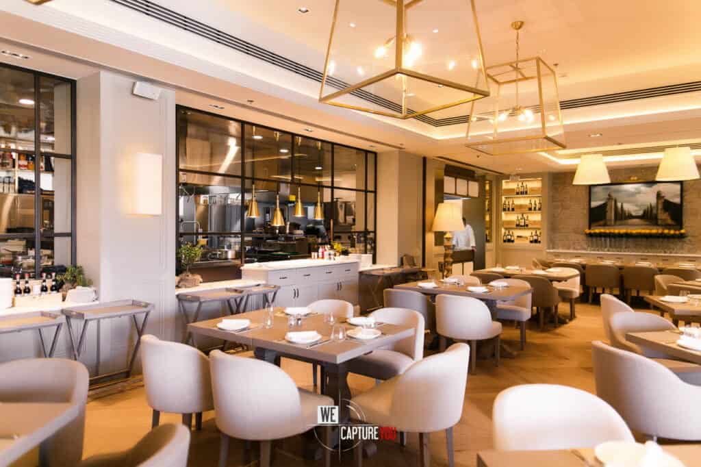 Stylish restaurant with modern decor, cozy seating, and warm lighting.