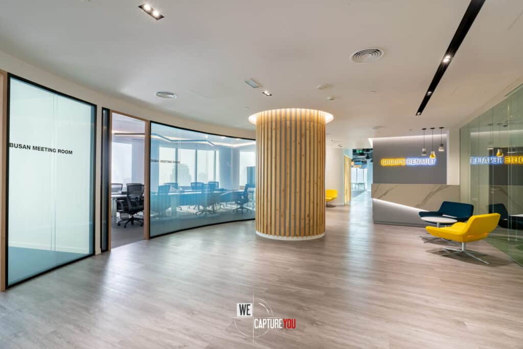 Contemporary office meeting room with glass walls and stylish furniture.