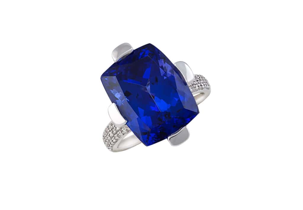 Stunning blue sapphire gemstone ring with diamond accents and silver band.