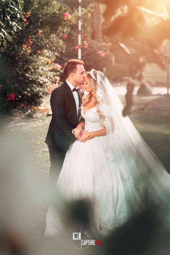 Beautiful bride and groom sharing a romantic moment outdoors.