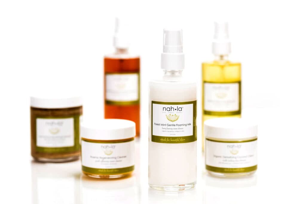 Collection of natural skincare products including sprays and creams.