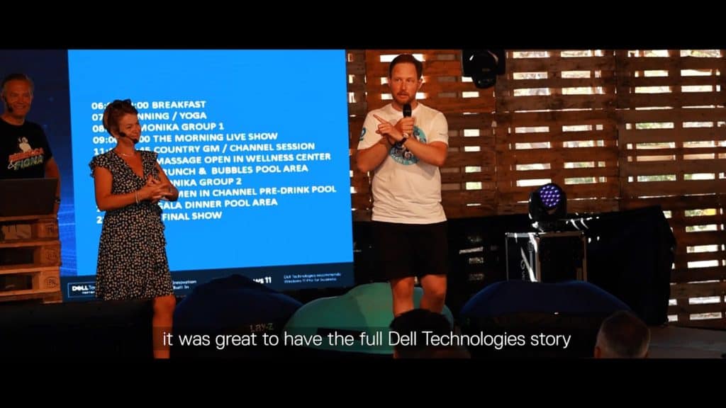Two speakers presenting at DELL GOBEYOND CROATIA event with a schedule displayed behind.