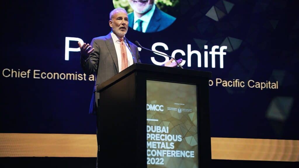 Speaker at DMCC Precious Metal Conference presenting on stage.