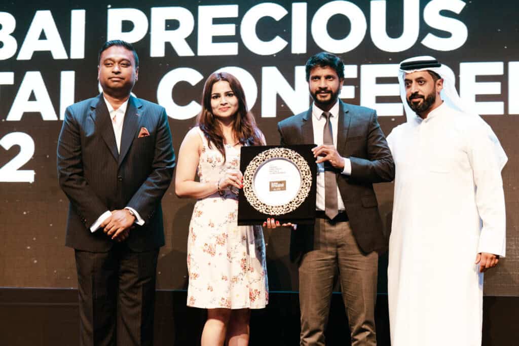 Group of professionals at DMCC Precious Metals Conference award ceremony.