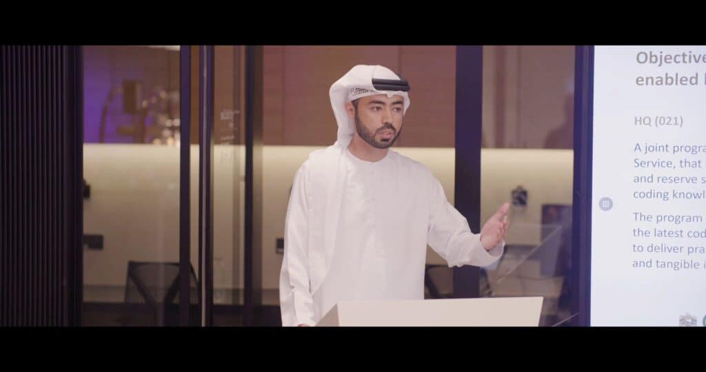 Business professional in traditional Middle Eastern attire at Dubai tour event.