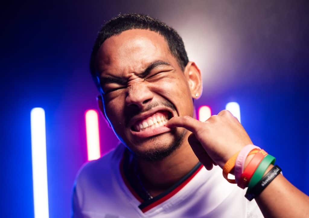 Expressive man with colorful wristbands making a playful face at MEDIA DAY DUBAI RUGBY 7'S REEL.